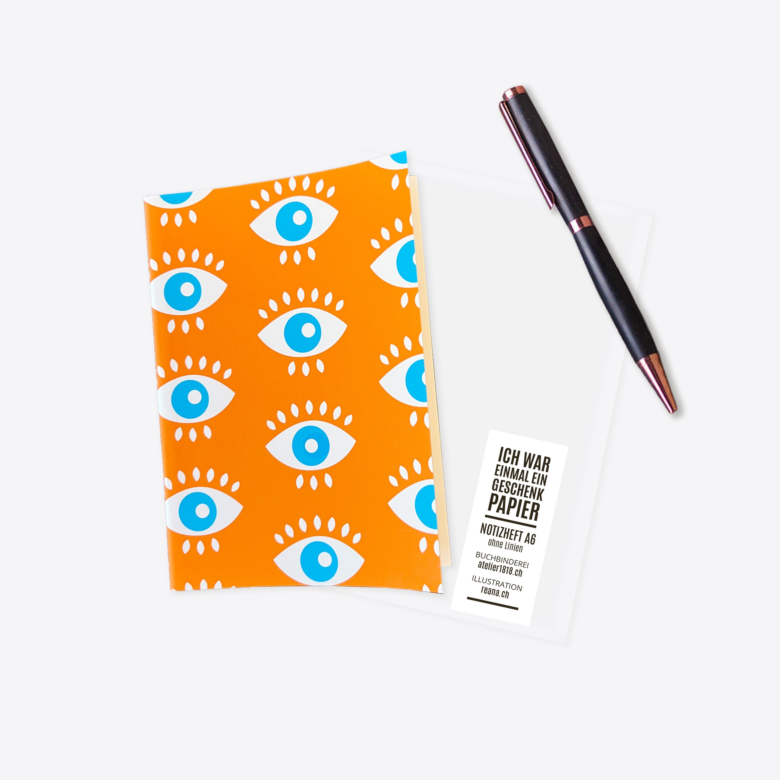 Notizheft aus Geschenkpapier – all eyes on me – orange – A6