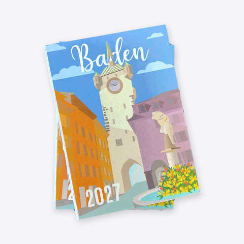 Deux agendas Stadtturm Baden 2027 superposés, de biais, avec la reliure cousue visible au dos