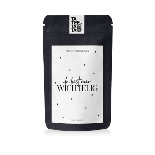 Black TaTeeTaTa tea pouch printed with «du bist mir WICHTELIG» and small stars